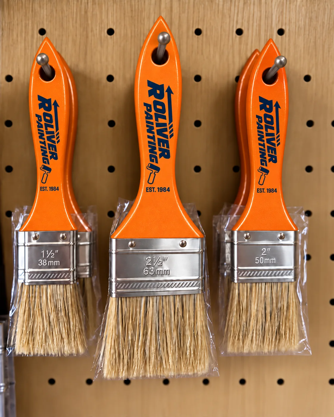 Orange R Oliver branded paint brushes